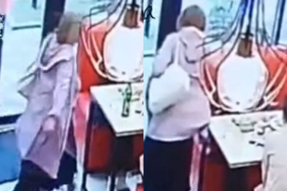 Женщина ударила девушку, сидящую за столом. Фото: скриншот из видео