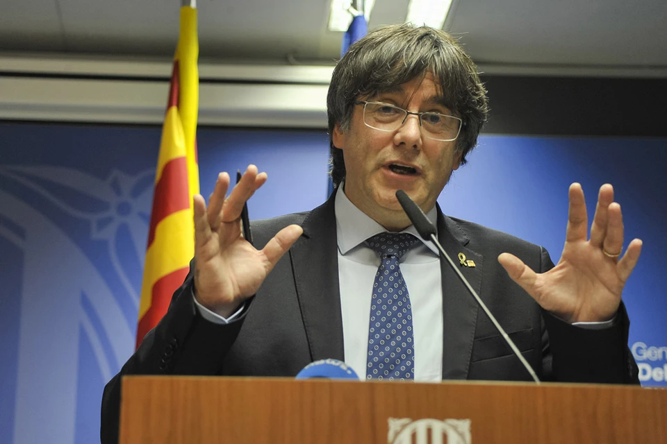 The democratically elected Puigdemont, under the threat of arrest, was forced to flee to Belgium, where he remains as a political emigrant.