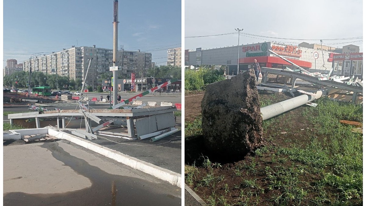 Огромный рекламный щит рухнул на тротуар во время сильного дождя с ветром -  KP.RU